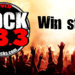 Rock 93.3 radio logo over concert crowd